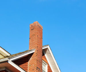 a masonry chimney with blue sky