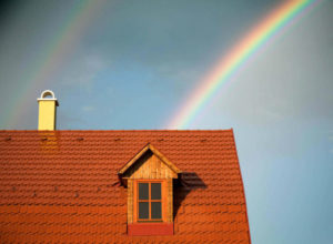 rainbow behind a house